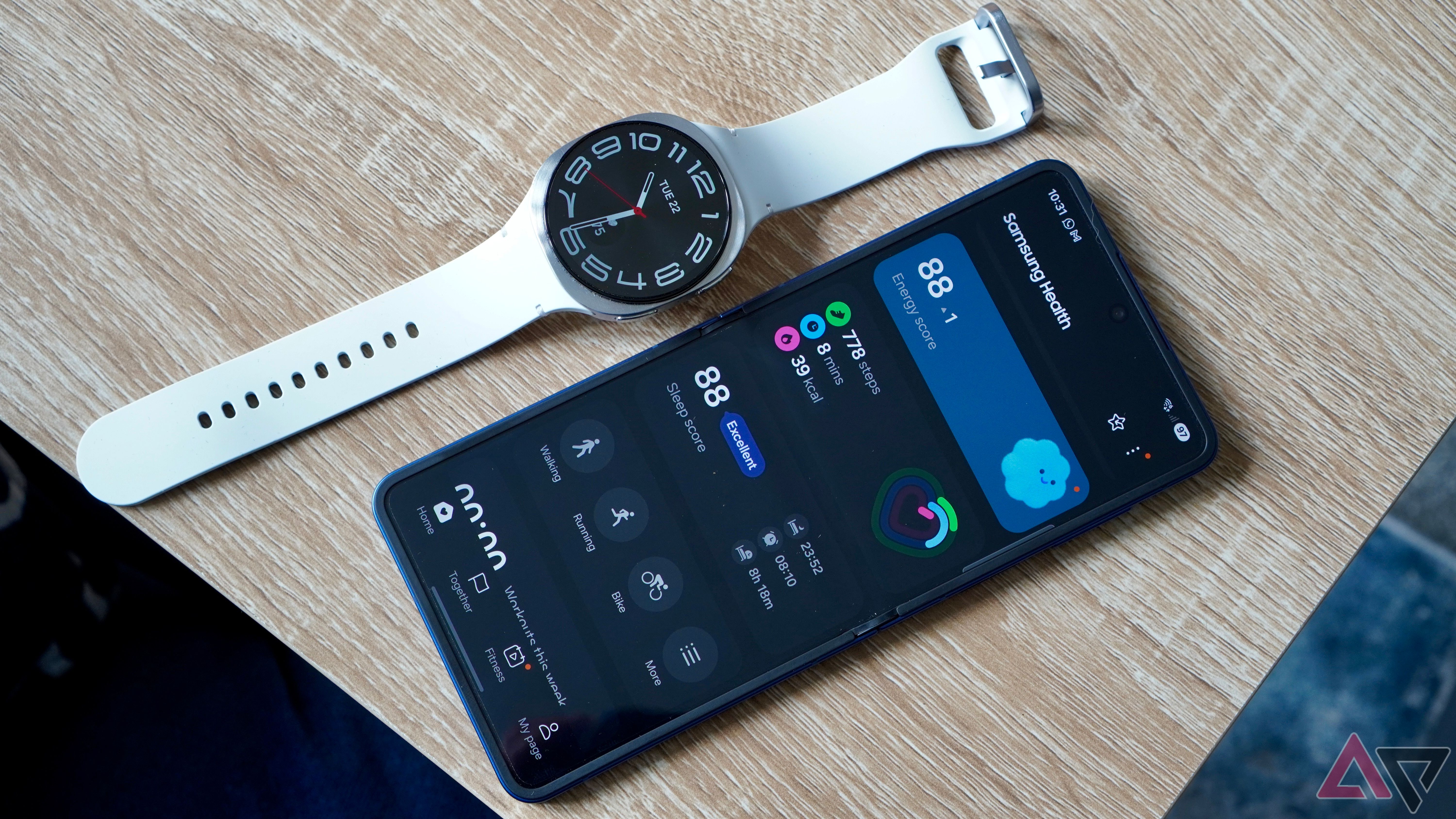 a galaxy watch 8 displayed next to a phone with Samsung Health app opened