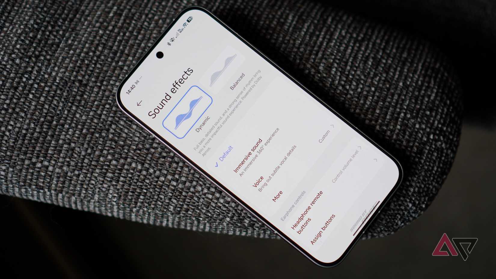 Acer Chromebook Plus 516 GE (2024) laying on gray blanked with screen showing wallpaper and dock
