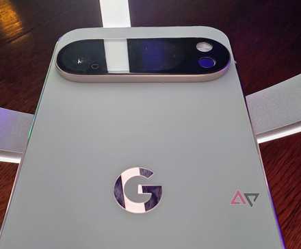 Google Pixel 9a laying on top of a Google Pixel 9 Pro XL