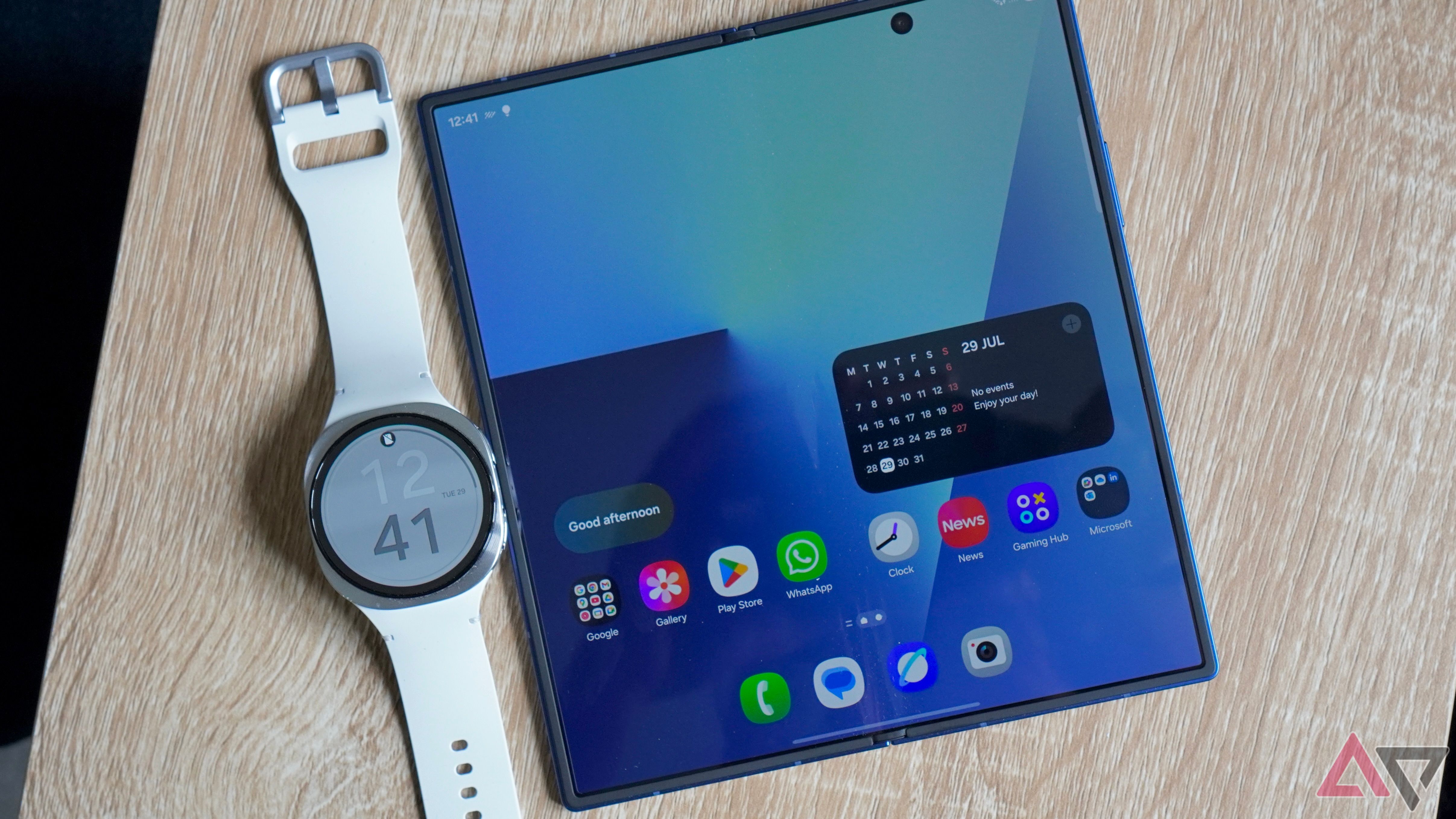 The Samsung Galaxy Watch 8 (left) and the open Samsung Galaxy Z Fold 7