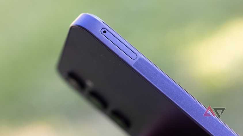 Person holding phone with RCS chat settings on display