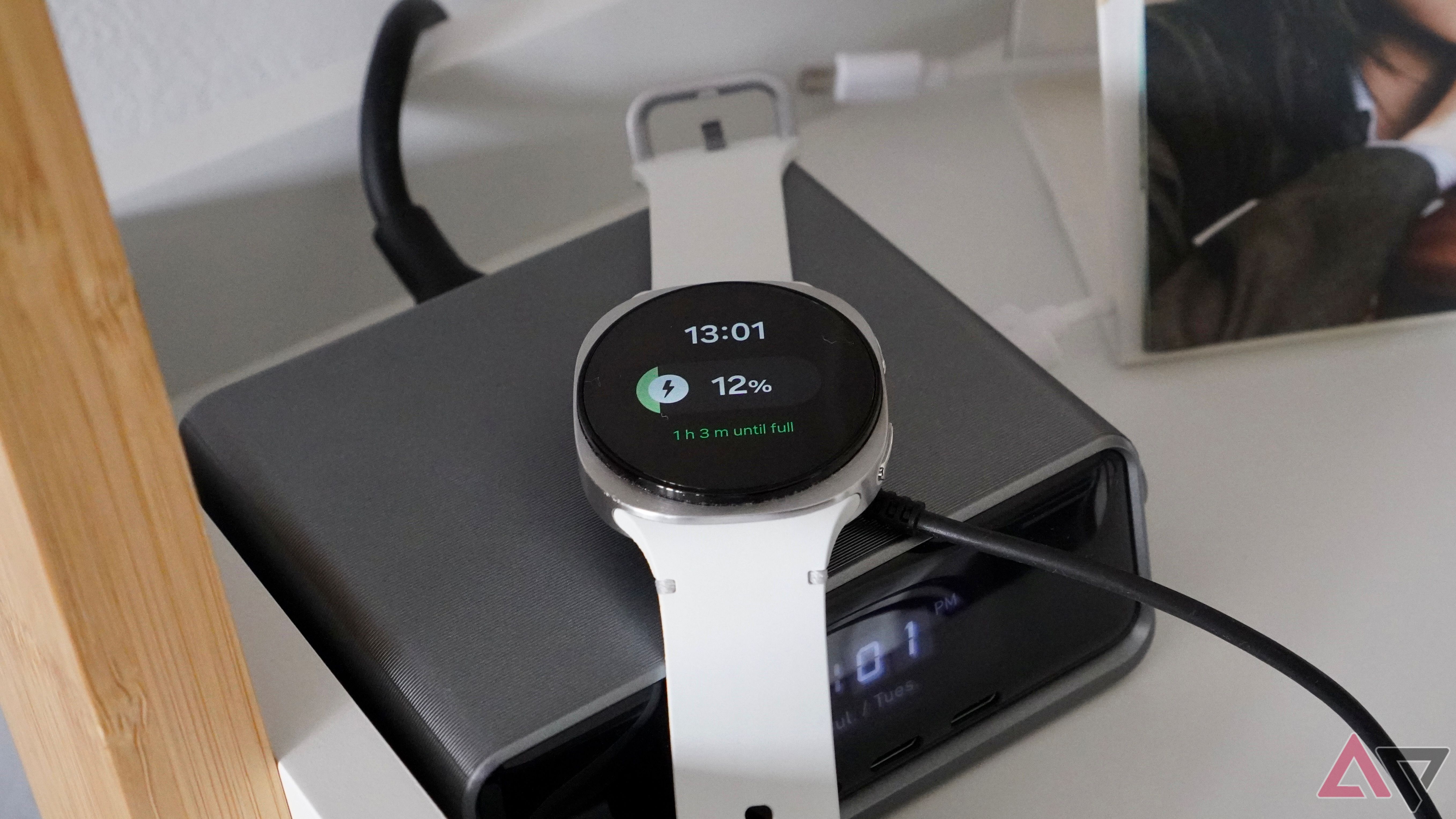 The Samsung Galaxy Watch 8 on its charging puck