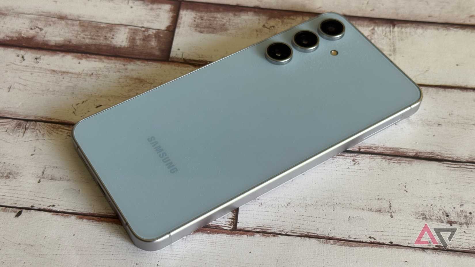 A Pixel 9 Pro sitting face-up on top of puzzle pieces.