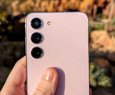 A person using a Galaxy S25 with the Galaxy Store logo next to it, notification icons turned off, and a disabled toggle switch in the center.