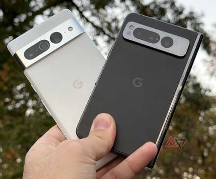 A hand holding the Google Pixel 9 Pro and the Google Pixel 9 XL, comparing the sizes of the two phones