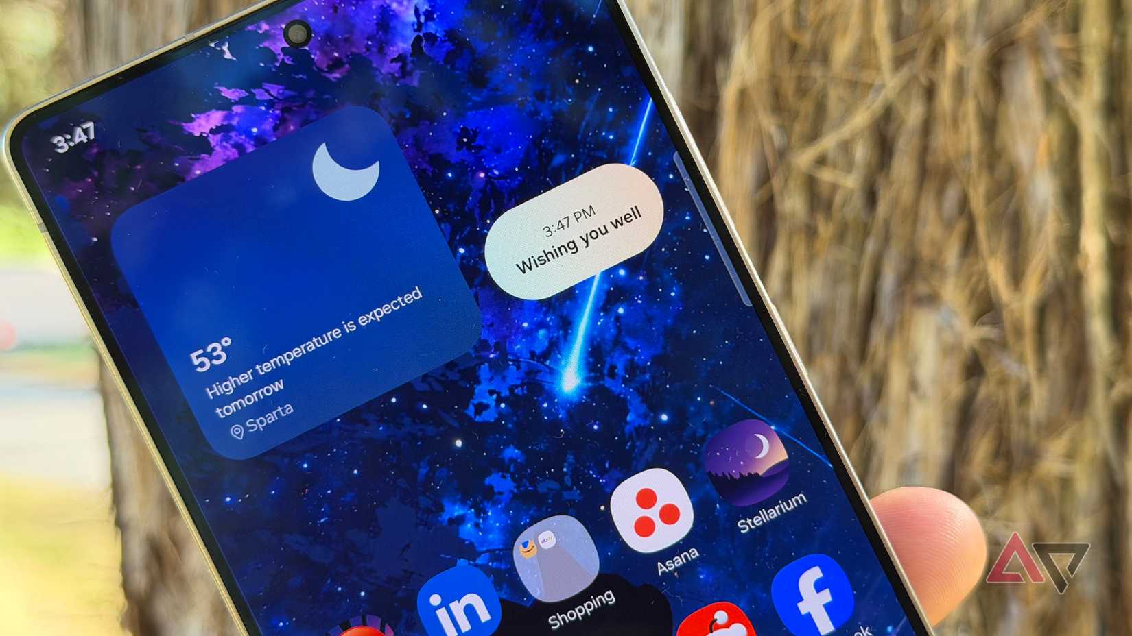 Motorola Razr Ultra held up against some trees in Cabaret
