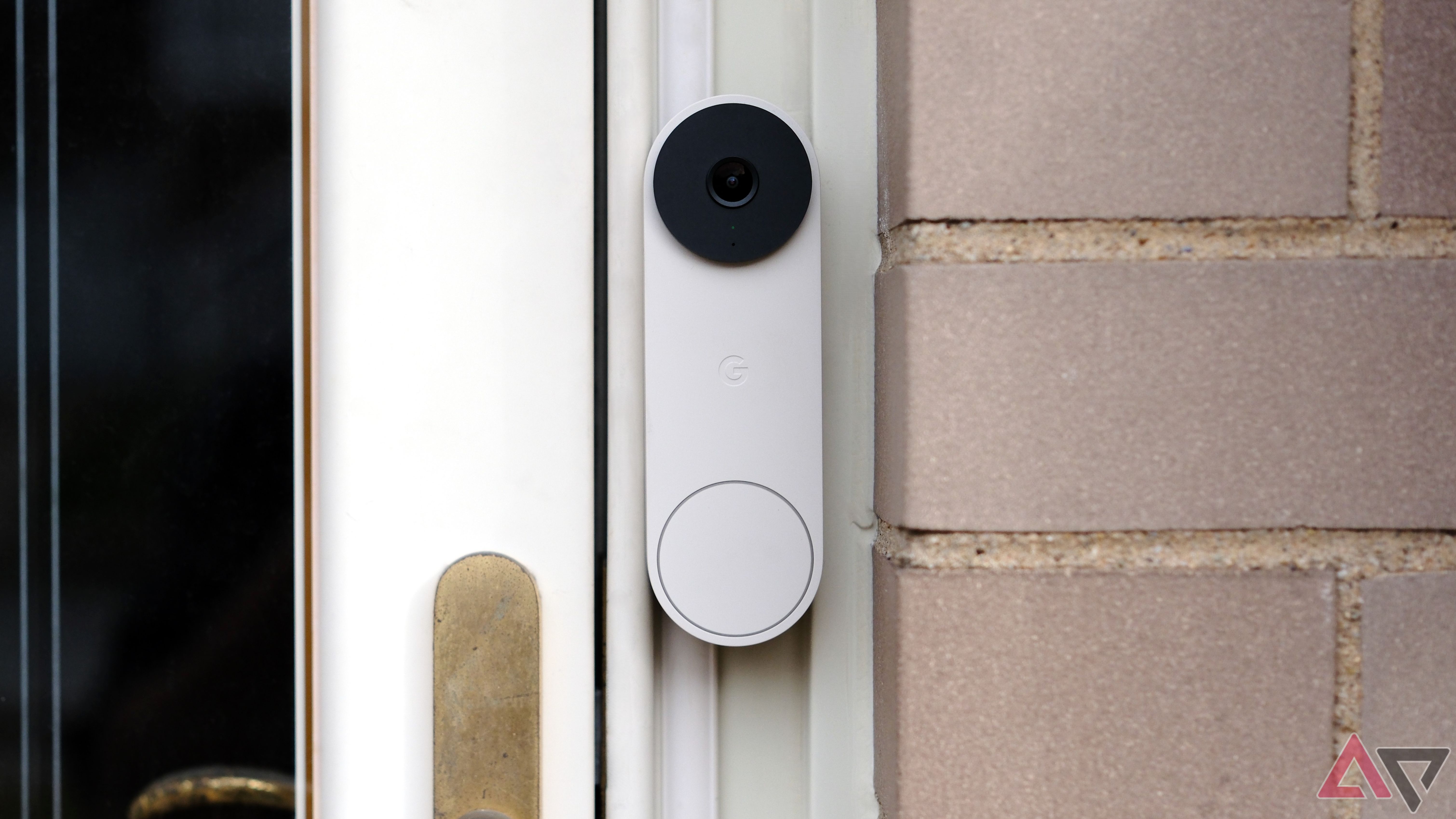Nest Doorbell on front door with green light on