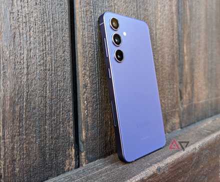 Hand holding Tecno Spark Slim showcasing its thin design