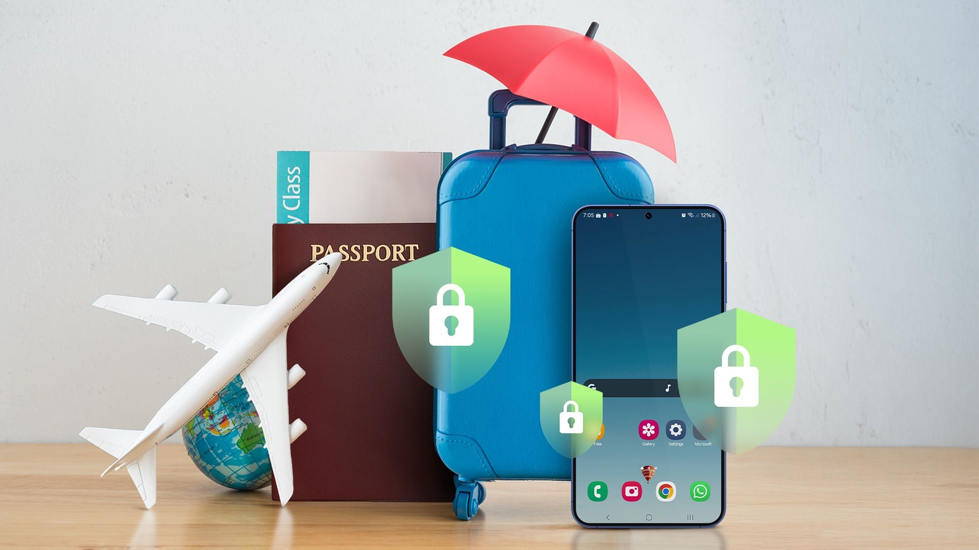A suitcase, passport, and other travel items, along with a phone displaying security shields.