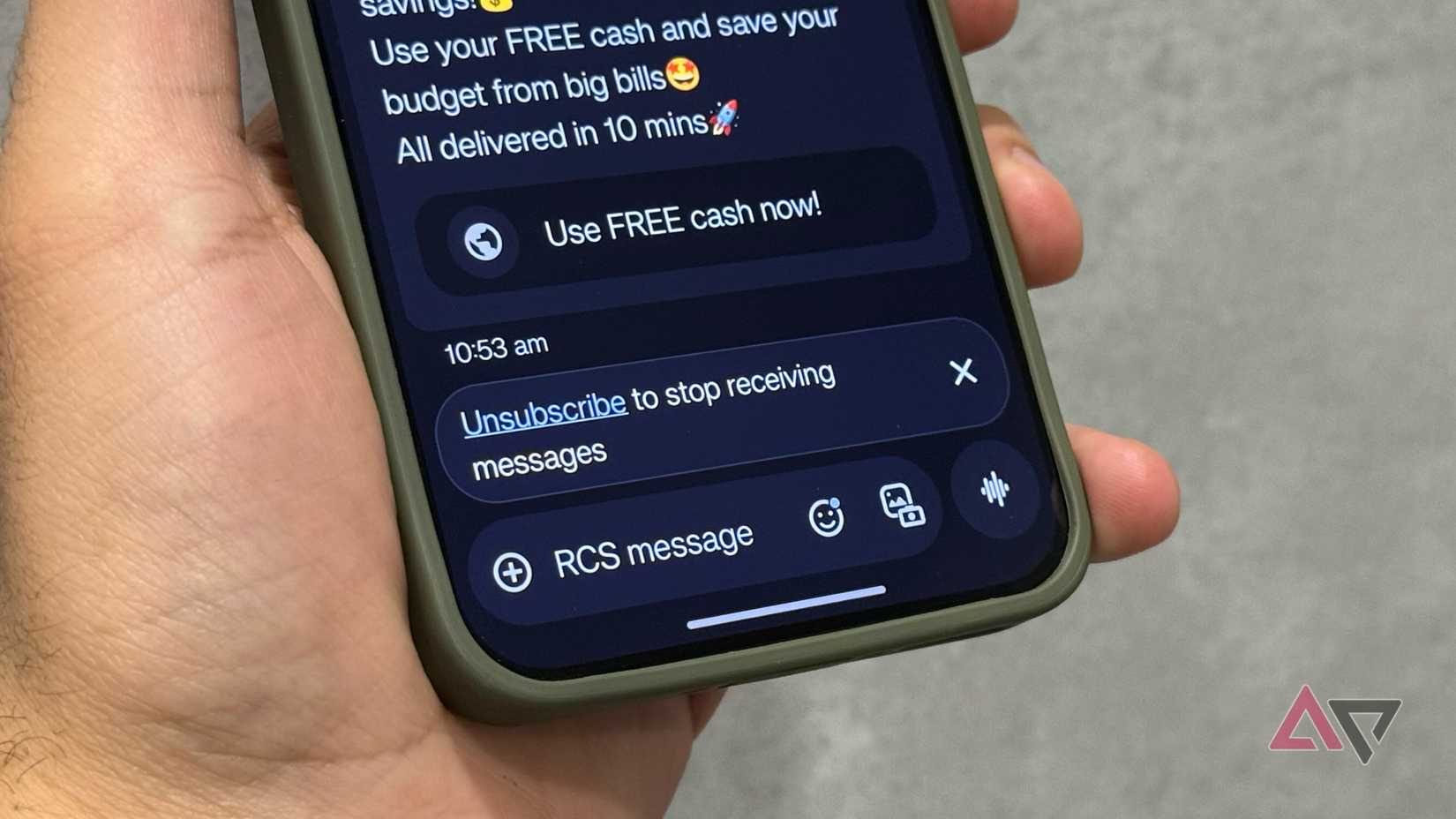 A spatula with the T-Mobile logo cut out of the face, on a pink background, between the two halves of the Android Police logo.