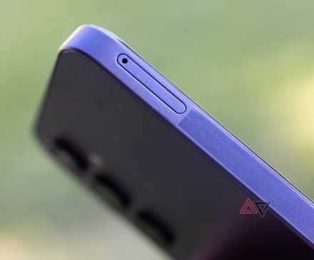 a phone showing a chat with Google Gemini next to the Gemini logo