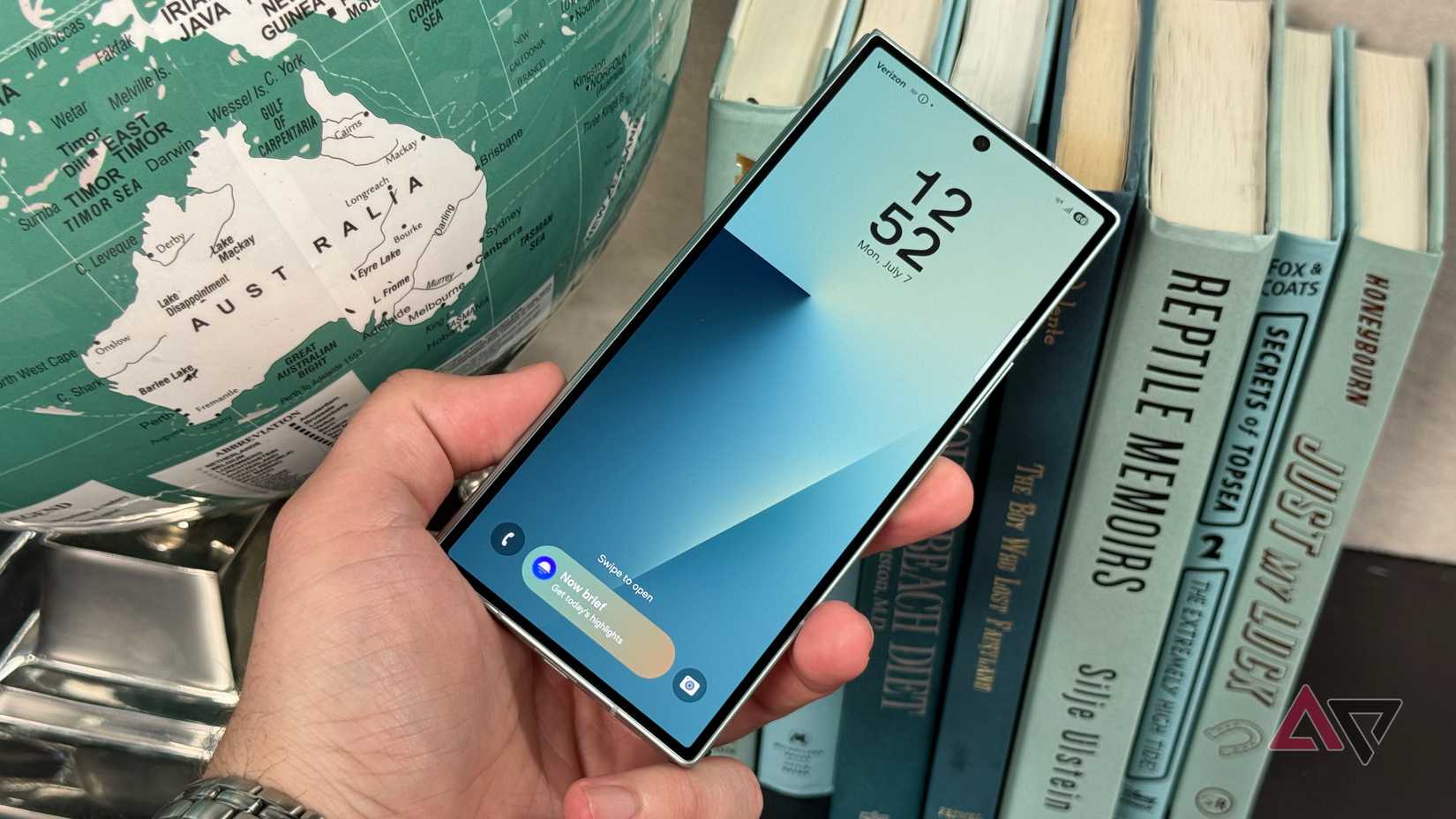 Huawei Mate XT Tri-Fold phone on a surface with folds