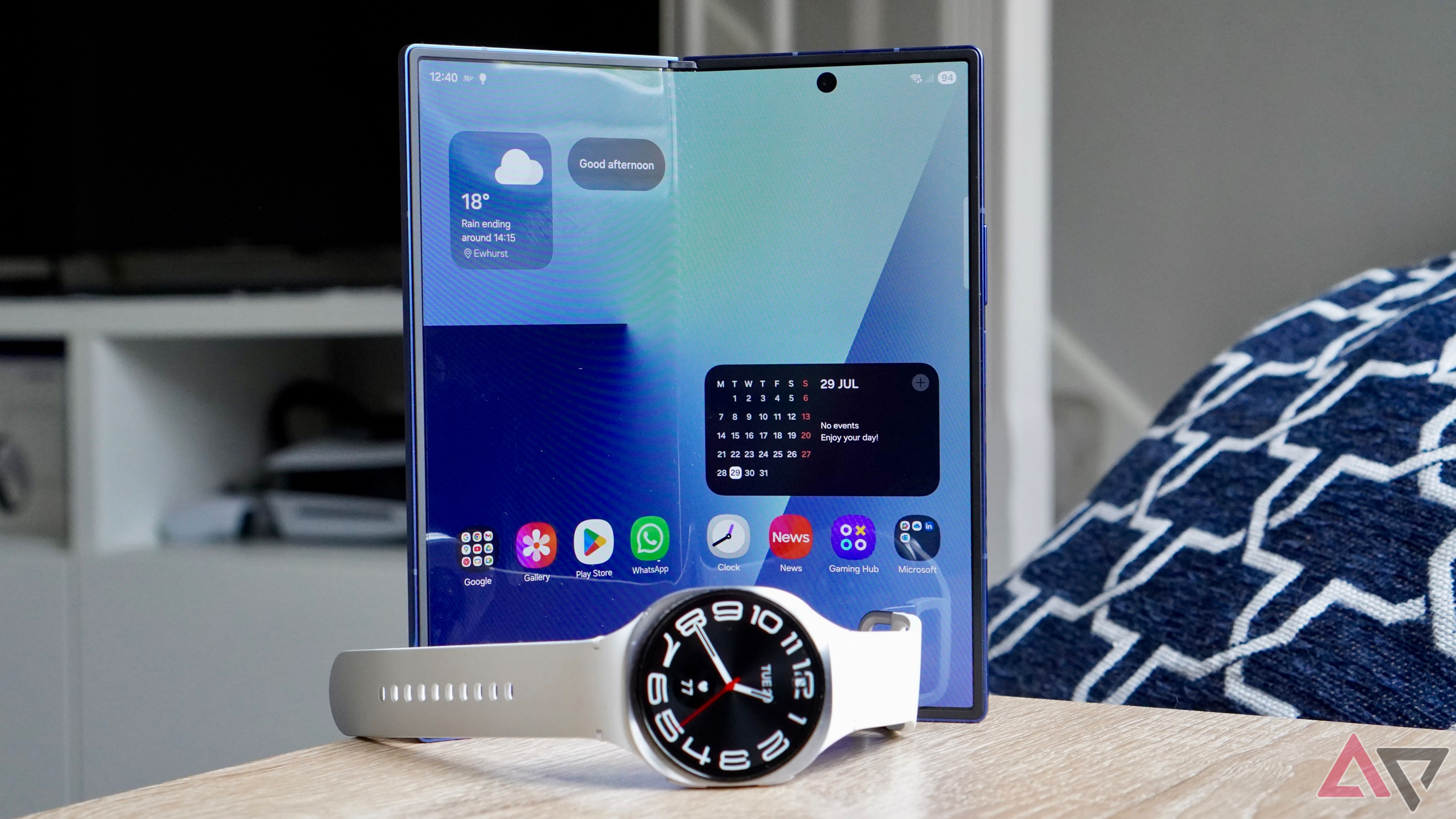 The Samsung Galaxy Watch 8 with the open Samsung Galaxy Z Fold 7