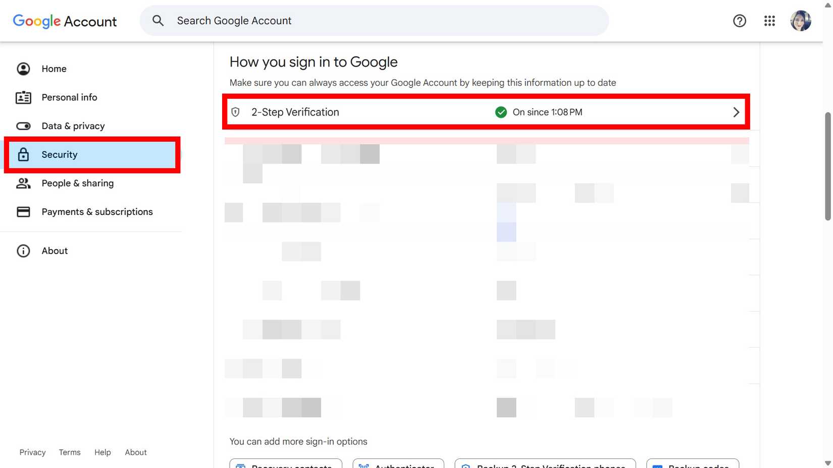 A person holding a Samsung Galaxy S20 FE with the camera app open with nature details in the background. 